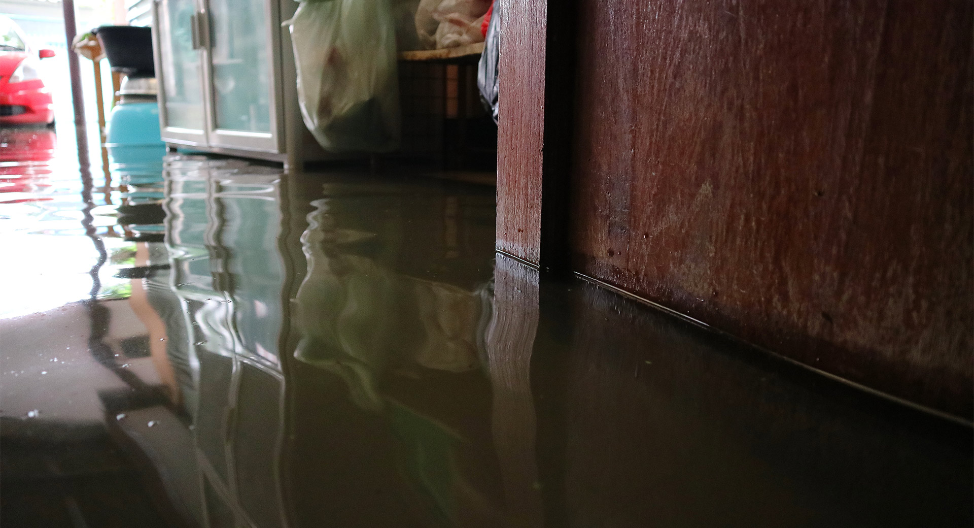 A flooded property with water on the floor